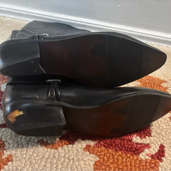 Elegant Black Leather Women's cowboy Boots boots on the ground