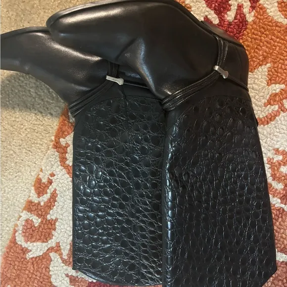 Elegant Black Leather Women's cowboy Boots boots on the ground