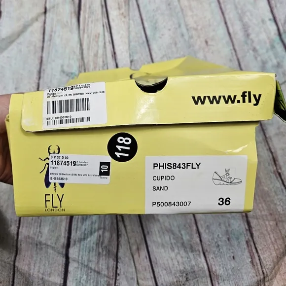 Fly London | Leather Tie Front Wedge in Sand