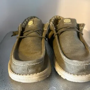 Hey dude, men’s size 10 shoes. In good used condition. Slip ons a tan color.