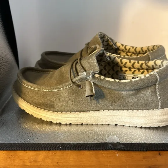 Hey dude, men’s size 10 shoes. In good used condition. Slip ons a tan color.