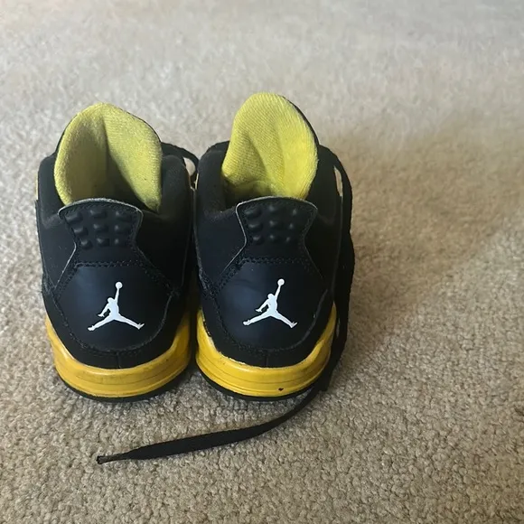 Jordan Black and Yellow Sneakers Air Jordan 4 Thunder